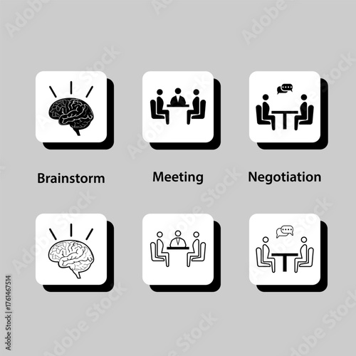 A group of people sitting around a table, with some of them holding a pen