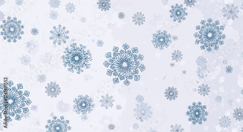 Falling snowflakes create a beautiful winter wonderland pattern with intricate crystalline designs in various sizes and shades of blue against a white textured background.