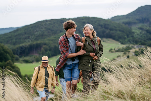 Grandmother and teen boy on hike trip.