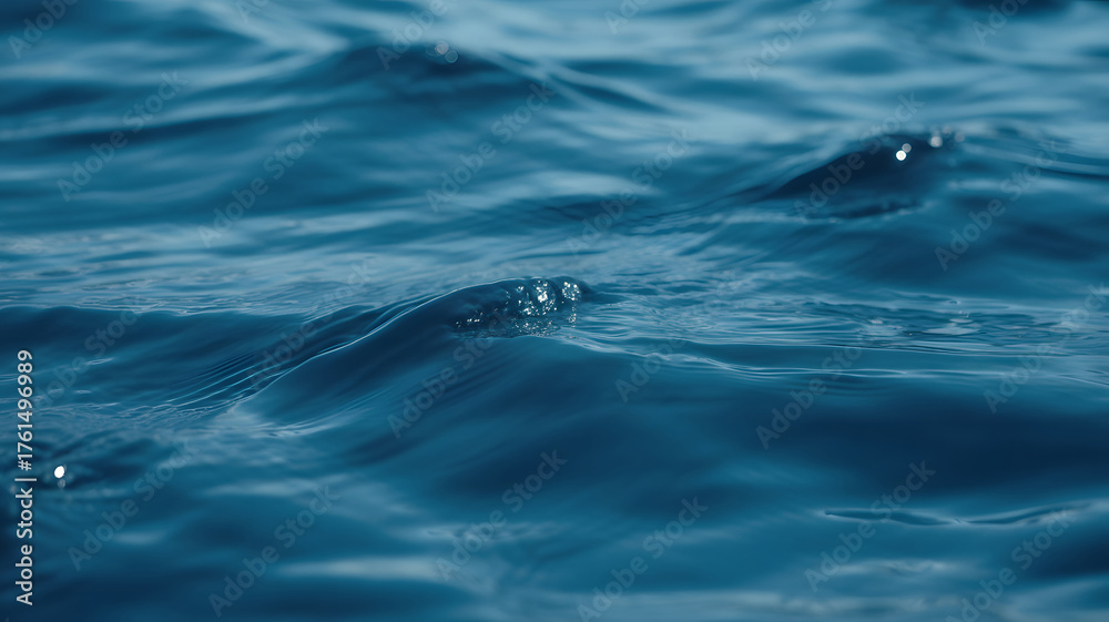 Fototapeta premium Close up of deep blue ocean waves with subtle ripples