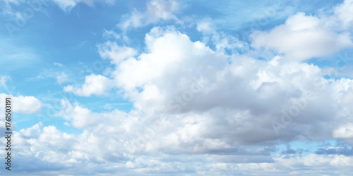 Bright summer day sky filled with beautiful cumulus and cirrus clouds, a perfect background for weather and nature concepts.