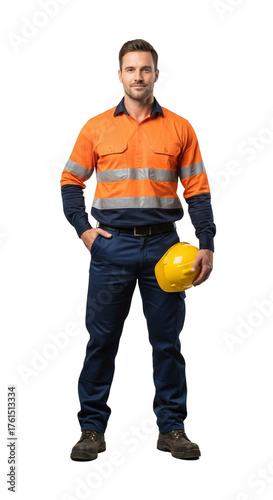 A confident construction worker stands, holding a helmet, looking directly at the viewer.