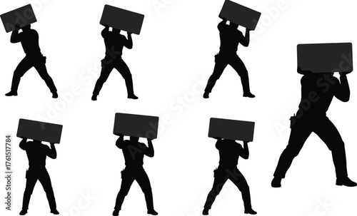 Powerful silhouettes of strong men lifting and struggling with a heavy rectangular load, demonstrating immense strength and determination on white, isolated.