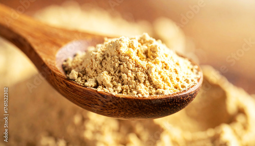 ashwagandha root powder on a wooden spoon, softly lit with warm tones. The natural texture and earthy color convey a sense of organic wellness and adaptogenic nutrition