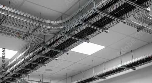 Cable trays carrying electrical wiring in an industrial setting