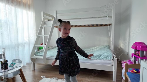 Cute little girl dancing and having fun at home