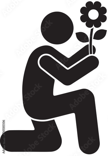 A romantic gesture of a person kneeling with a flower