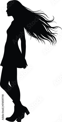Silhouette of stylish woman with flowing hair in short dress and boots standing in profile for fashion, elegance, and beauty concept