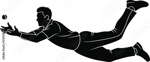 Silhouette of a cricket player diving to catch a ball