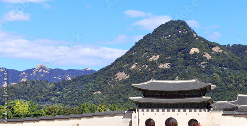 Horizontal banner with Gwanghwamun Gate of Gyeongbokgung palace complex and Inwangsan Mountain,  Seoul, Republic of Korea. Topic of summer vacation, travel, trip abroad on vacation, cruises and tours