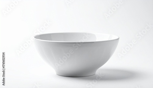 A plain white ceramic bowl with a subtle speckled pattern and smooth surface sits empty against a white background