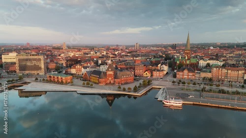 Morning aerial shot of Aarhus old town, Denmark. Skyline of Aarhus with its beautiful buildings and serene waterfront during the golden hour of sunrise