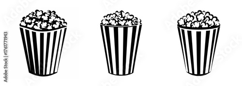 Three striped popcorn buckets full of fluffy popcorn for movie night snacks