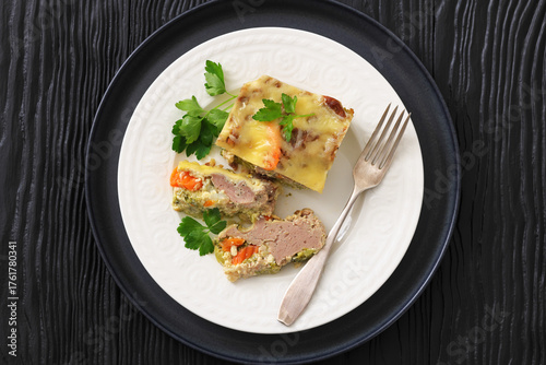 Cheesy ground meat vegetables casserole on a plate