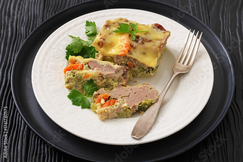 Cheesy ground meat vegetables casserole on a plate