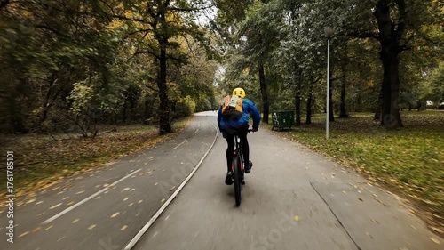 Wallpaper Mural 4K footage of a man cycling through a forest path surrounded by autumn leaves and trees on Ada Ciganlija Island in Belgrade, Serbia. Captured in motion from behind Torontodigital.ca