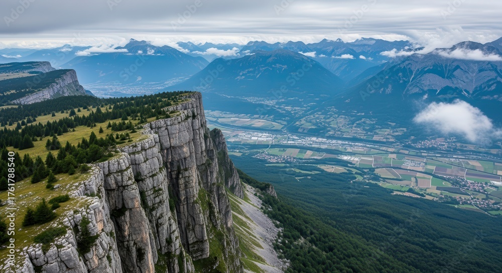 Naklejka premium Dramatic Limestone Cliffs Overlooking a Valley and Mountains