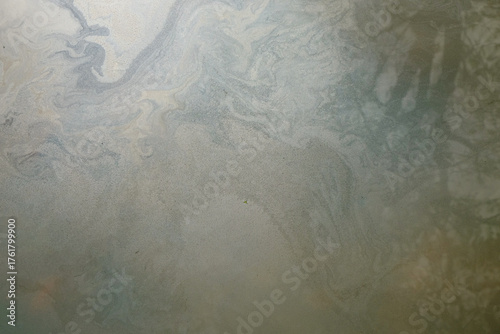 Abstract textured background of oily river water surface.Ecology and environmental concept. Water pollution. For graphic design, banners and 3D rendering