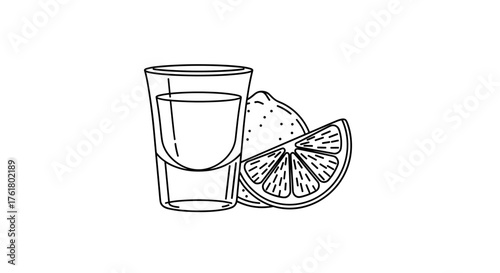 A refreshing shot of tequila with a slice of lemon next to it.