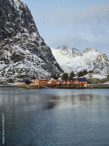 A view of the beautiful fishing village of Hamnoy with its iconic rorbuer in winter
