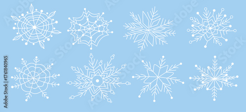 White snowflakes on a blue background in doodle style. Hand-drawn vector snowflake illustration. Festive frosty elements in a minimalist style. Snowflake icons, snow symbol. Snow