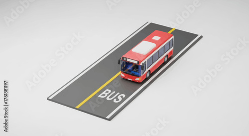 Miniature red double-decker bus model on a grey road with BUS marking.