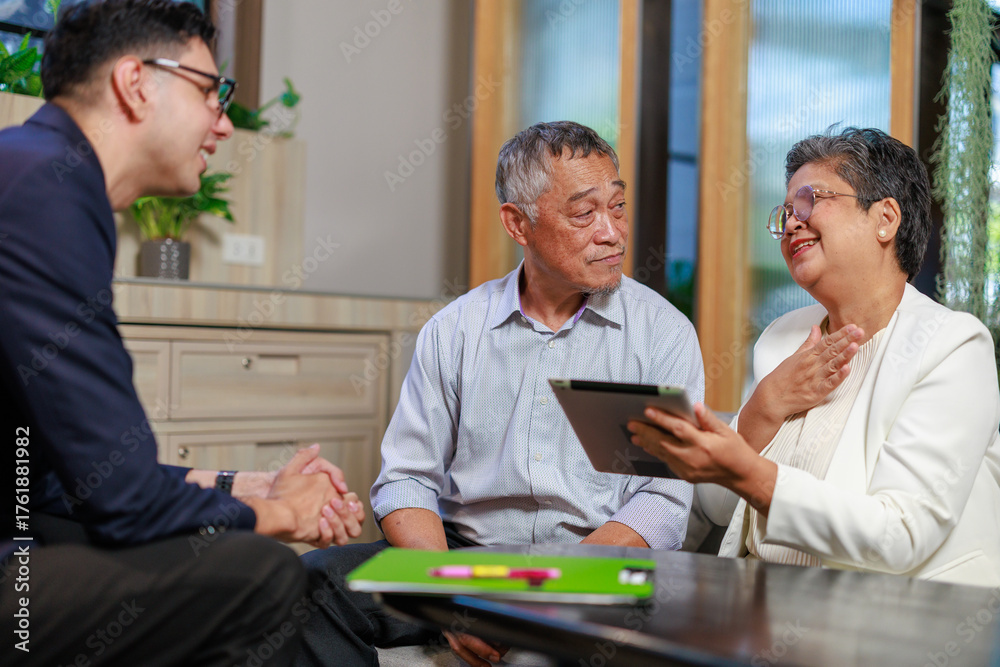 Fototapeta premium senior asian couple meeting financial advisor in modern office shaking hands after successful business discussion showing trust partnership communication and retirement planning consultation