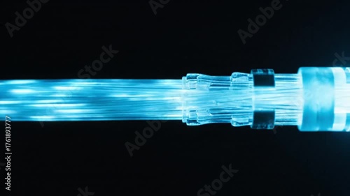 Glowing Blue Fiber Optic Cable Transmitting Digital Data at High Speed.