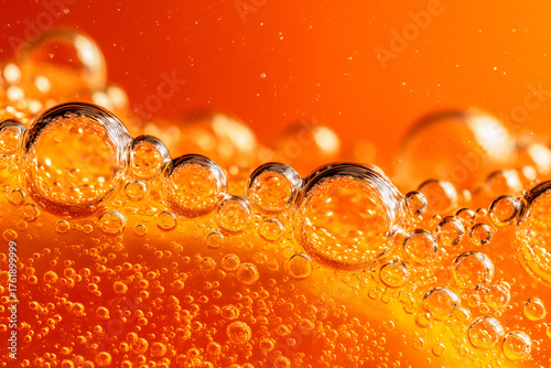 Vibrant close-up of sparkling orange soda bubbles for refreshing summer ads, dynamic energy drink promotions, or captivating beverage product visuals