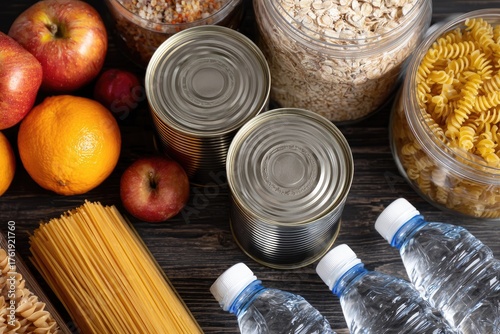 Assortment of pantry staples including pasta, canned goods, fruit, and water bottles