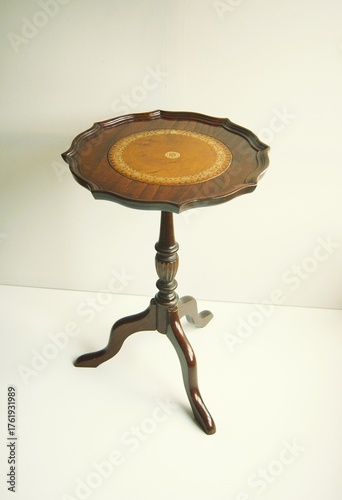 English table with brown leather table top. 