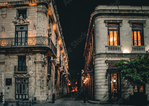 Canvas Print Historic Colonial Street at Night with Warm Lighting
