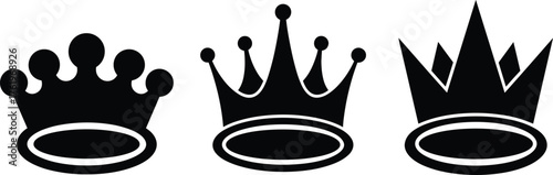Set of three vector black silhouettes of crowns isolated on a white background.