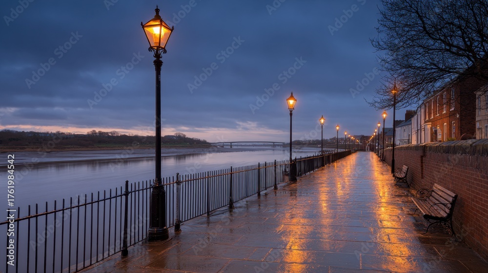 Obraz premium Tranquil Riverside Path with Vintage Street Lamps and Calm Water Reflection at Dusk