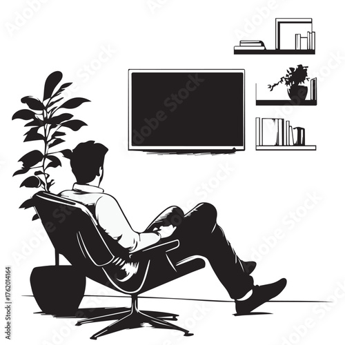 man sitting on a chair and watching tv
