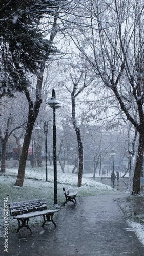 Snowing in a public park in slow motion