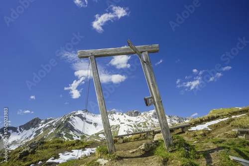 Part of the art action Oeffne die Tuer fuer eine andere Welt, Porta Alpinae at the Zeigersattel, behind it the Nebelhorn, 2224m, Allgaeuer Alps, Bavaria, Germany