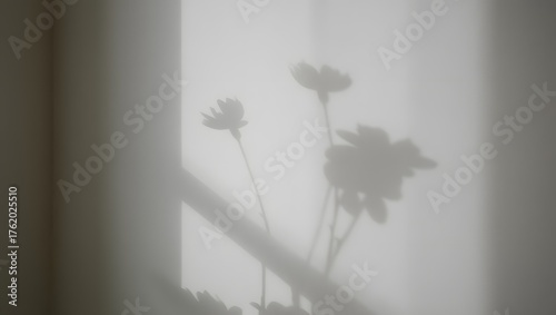 Soft floral silhouette cast by sunlight through sheer curtains