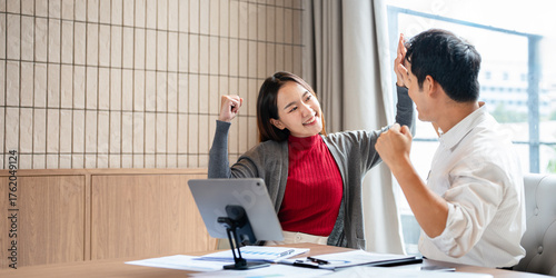 Celebrate and victory to business success with colleagues, celebration  with co-worker partner , winner successful with startup teamwork having smile happy together.