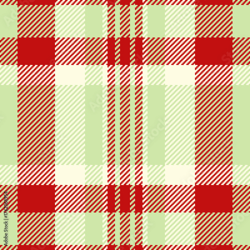 Classic plaid pattern in red and soft green hues. Textile design for apparel, backgrounds, or festive decorations. Seamless, versatile texture.