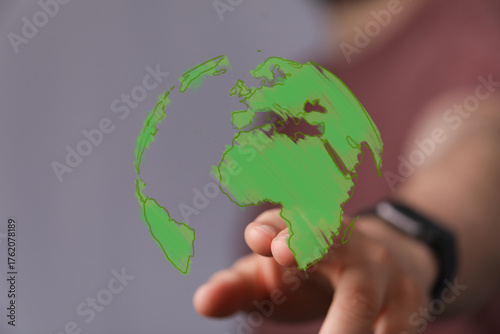 A hand gently interacts wit...