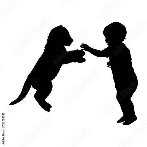 Child and puppy playing silhouette interaction