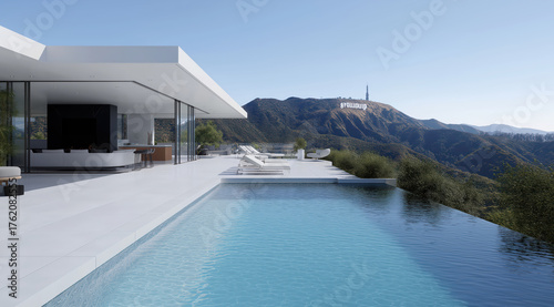 Modern luxury home with infinity pool overlooking the Hollywood Hills on a sunny day