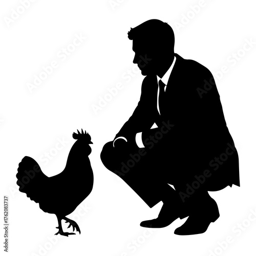 Man in suit crouching near rooster silhouette