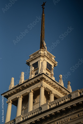 A big old clock tower. A spire with a star.
