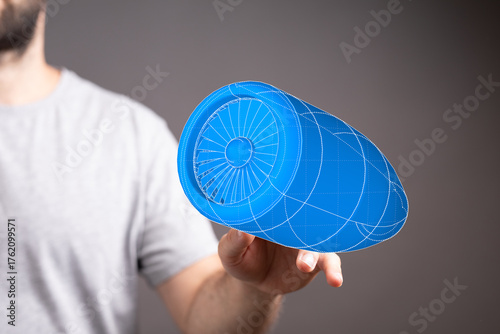 A man holds a vibrant blue ...