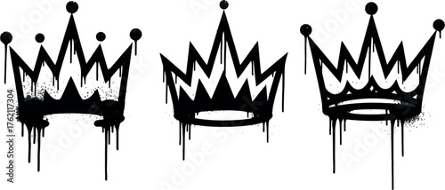 Three black spray paint crown symbols with dripping effect isolated on royalty free