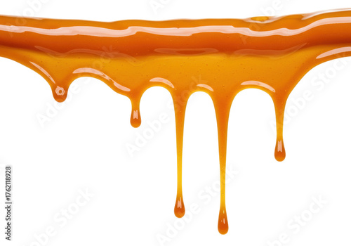 Golden caramel sauce dripping isolated on transparent background, sweet dessert topping for ice cream and confectionery use