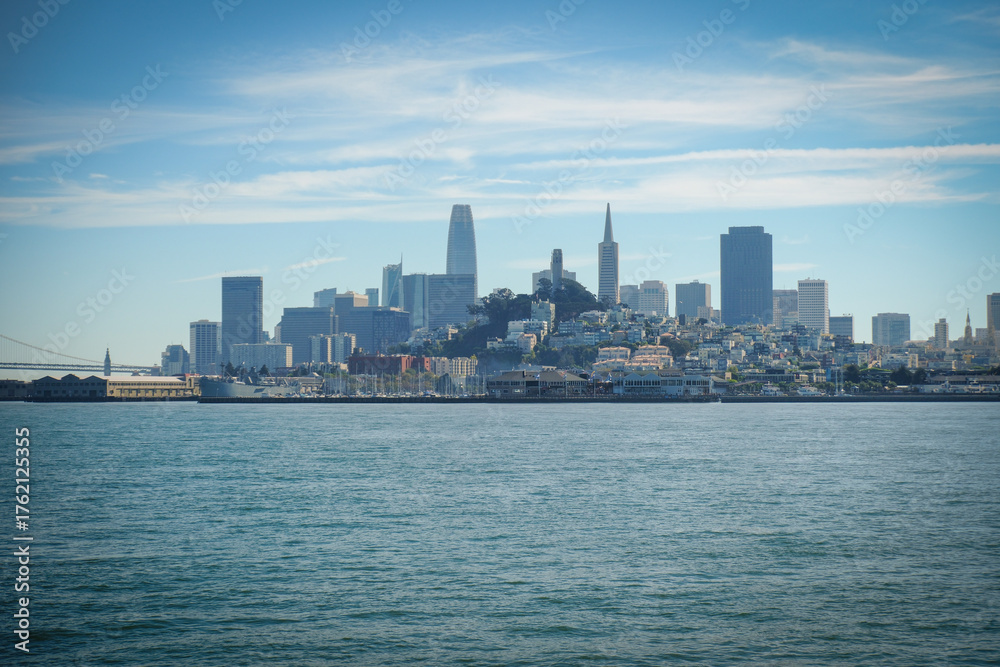 Naklejka premium A view out to the San Francisco Skyline showing the sky scrapers from a boat out in the Bay