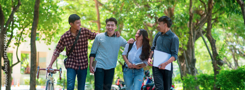 Group of Diversity Student working and walking together in park at university,Happy multiethnic friend study in asian college.Multiethnic and diversity student Concept